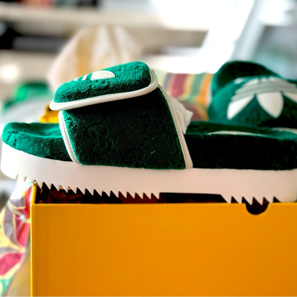 New authentic 💯 % Gucci X Adidas slides in green color with Adidas logo on top.